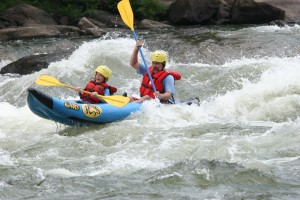 Man and boy rafting